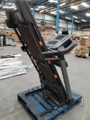 A NordicTrack Folding Treadmill, (non-functional, sold for parts/repairs).