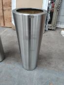 A Superline Conica topper on ring tall indoor planter.