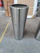 A Superline Conica topper on ring tall indoor planter.