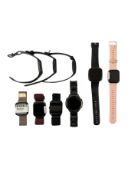 Assorted pre-owned smartwatches including Fitbit and Kospet (Sold as is).