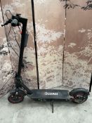 A pre-owned iScooter i10Plus electric scooter (sold for repair or spares, with charger).