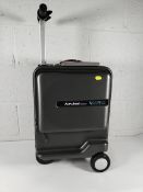 A pre-owned Airwheel robot ride-on luggage with battery.