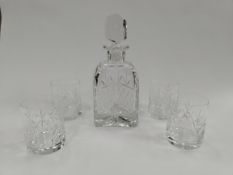 A luxury decanter and whiskey glass set (branded).