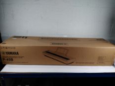 An as new Yamaha P-45 b digital keyboard (box is opened).