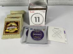 Twenty sets of assorted guitar strings to include Ernie Ball Earthwood acoustic 11-52 and Fender ele