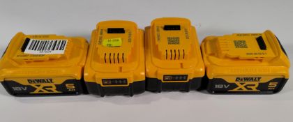 Four 2025 DeWalt XR 18v power tool batteries.