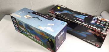 Two pre-owned hover boards to include Hover Trax and Go Trax.