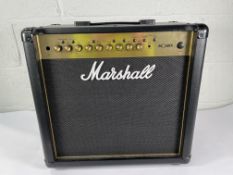 A pre-owned Marshall MG50GFX Gold 50W guitar combo amp (input port needs replacing).