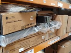 A shelf of assorted musical accessories, stands and related.