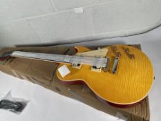 An Antiquity Legends LS1-TA Amber electric guitar.