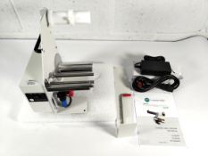 A Labelmate LD-100-RS label dispenser for length 6mm - 150 mm labels, with instructions, bracket and