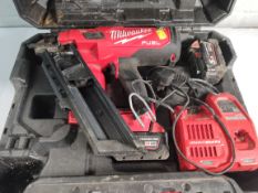 Pre-owned Milwaukee M18 FFN framing nailer with batteries and case.