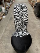 An as new Zebra Print High Heel Shoe Chair (unbranded).