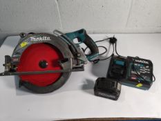 A pre-owned Makita RS002G circular saw with 2 x 40v batteries and charger.
