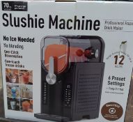 A Slushi Professional frozen drinks maker (box unsealed, UK adapter required).