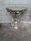 A decretive table with matching mirror.