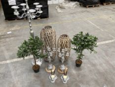 A tall standing candelabra, two small candelabras, two wicker candle lanterns, two small artificial
