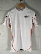 Approximately 100 as new Risen Fightwear Burning Bush MMA Rashguards (various sizes).