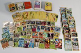 An assortment of Pokemon TCG cards and a Pokemon Tin.