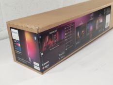 An as new Philips Hue Signe Gradient Floor Lamp in Oak (REF: 8719514445291).