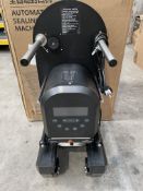 An SKMA F-90 Automatic sealing Machine, black (some minor damage, sold as seen).