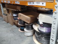 A shelf of assorted electrical and plumbing items.