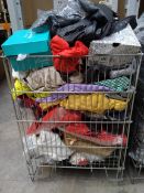 A basket of new clothing to include footwear, t-shirts, trousers, jackets and related items (basket