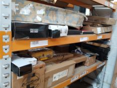 Two shelves of audio and musical related products.