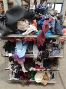 A quantity of pre-owned clothing and related (four shelf basket not included).