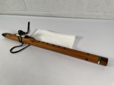 An as new Woodsounds Mid G-4 T3J handcrafted flute with a black bear totem.