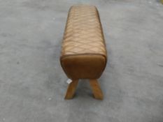 Preowned brown leather stool with wooden legs. 88cms x 32cms x 47cms.