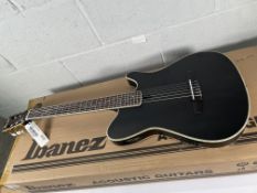 An as new Ibanez Tim Henson TOD10N-TKF nylon string, electro guitar, Trans Black Flat.