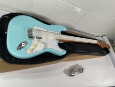 A boxed as new Fazley Sunset Series Dawn HSS Sky Blue Electric Guitar with gig bag.