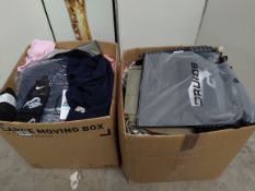 A large quantity of new clothing with tags to include Zara, Calvin Klein (two boxes).