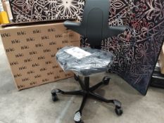 An as new HÅG Capisco Puls 8020 chair ergonomic saddle seat in black.