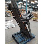 A NordicTrack Folding Treadmill, (non-functional, sold for parts/repairs).