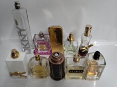 Fifty two perfumes/testers and related to include Dior, Boss, Paco Rabanne, Versace and Gucci (pleas