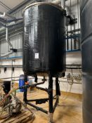 A vertical stainless steel mixing tank, 3000L Max Load.