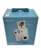 As new Fujifilm Instax Mini 12 Instant Camera in Clay White (EAN: 4547410489095) (Damage to box).