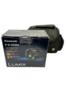 Pre-owned Panasonic Lumix FZ200 12.1MP Digital Bridge Camera with battery, charging dock, storage ba