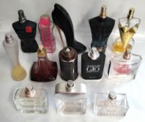 Fifty five perfumes/testers and related to include Carolina Herrera, YSL, Gaultier, Chanel, Dior, Va