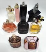 Forty perfumes/testers and related to include YSL, Boss, Paco Rabanne, Armani and more (please note: