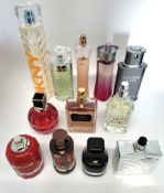 Fifty perfumes/testers and related to include Boss, Gucci, Elle Saab, Giorgio Armani, Estee Lauder a