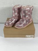 A pair of children's Ugg Classic Short 2 sequin star boots (UK 3).