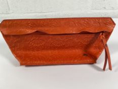 A pre-owned Velez leather purse, orange.