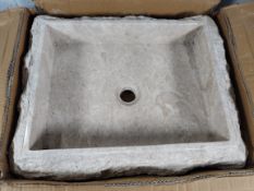 An as new rectangular stone sink with rough hewn exterior, colour: cream, Size 50 x 40 x 12 cm.