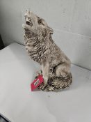 A Howling Wolf stone garden ornament.