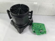 A Wacky inflatable man with fan blower.