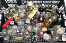 Fifty empty / near empty perfume bottles and related to include Versace, Jimmy Choo, YSL and Moschin
