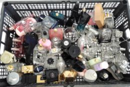 Fifty empty perfume bottles and related to include Prada, YSL, Chloe and Paco Rabanne (packaging may